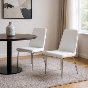 HomeRoots Set of Two Elegant Upholstered Faux Leather Dining Chairs with Sleek Silver Accents for Style White 332575