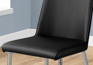 HomeRoots Set of Two Elegant Upholstered Faux Leather Dining Chairs with Sleek Silver Accents for Style Black 332576