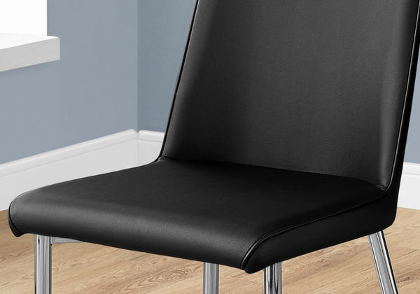 HomeRoots Set of Two Elegant Upholstered Faux Leather Dining Chairs with Sleek Silver Accents for Style Black 332576