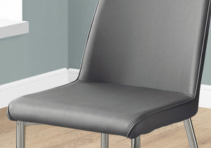 HomeRoots Set of Two Elegant Upholstered Faux Leather Dining Chairs with Sleek Silver Accents for Style Grey 332577