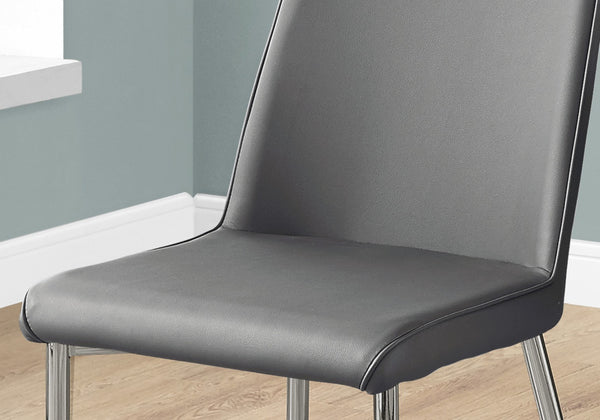 HomeRoots Set of Two Elegant Upholstered Faux Leather Dining Chairs with Sleek Silver Accents for Style Grey 332577