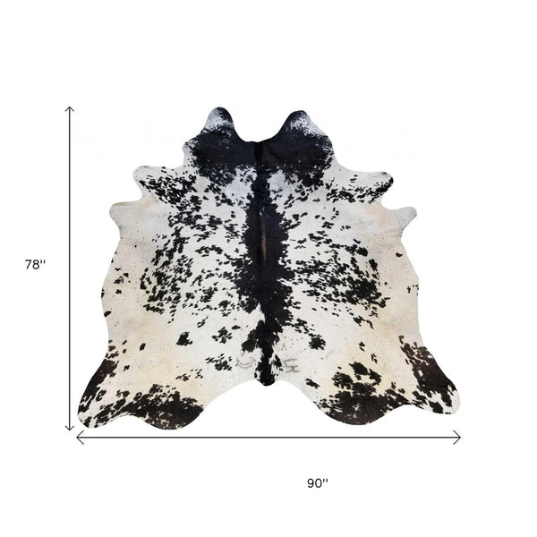 HomeRoots 6' Handmade Cowhide Area Rug - Rustic Elegance, Unique Texture, Durable Design for Any Space Black and White 334417
