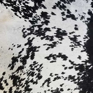 HomeRoots 6' Handmade Cowhide Area Rug - Rustic Elegance, Unique Texture, Durable Design for Any Space Black and White 334417