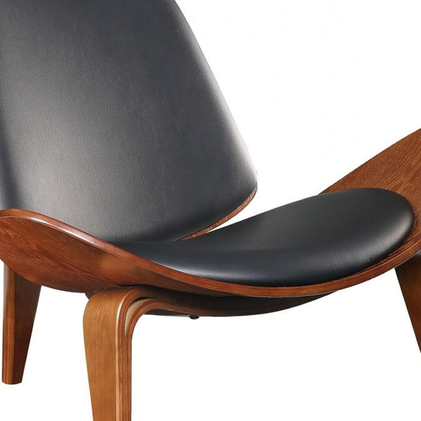 HomeRoots 30" Stylish Black Faux Leather Side Chair with Brown Wooden Legs for Modern Living Spaces & Comfort 347298