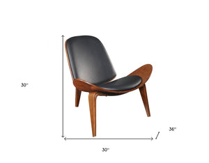 HomeRoots 30" Stylish Black Faux Leather Side Chair with Brown Wooden Legs for Modern Living Spaces & Comfort 347298