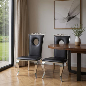 HomeRoots Set of Two Chic Black and Silver Faux Leather Dining Chairs for Modern Glam and Versatile Comfort 347320