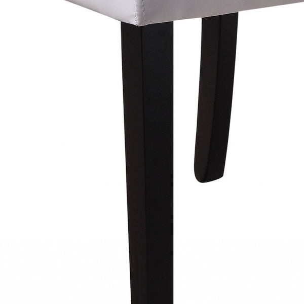 HomeRoots Set of Two Stylish White and Black Upholstered Faux Leather Dining Chairs for Modern Spaces 347335
