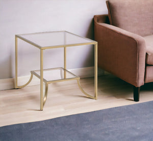 HomeRoots 24" Gold and Clear Glass End Table - Modern Glam Accent for Living Room, Bedroom, or Snack Use 347398