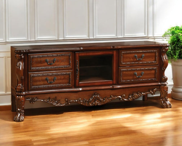HomeRoots 21" Elegant Wood and Glass TV Console with Classic Scrollwork and Ample Storage for Any Space Cherry Oak 347488