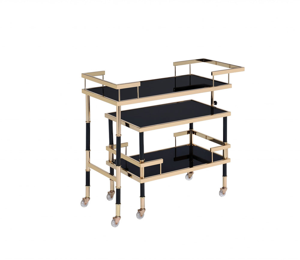 Homeroots 16" X 36" X 34" Gold Black Smoky Glass Metal Casters Serving Cart  Metal 347565