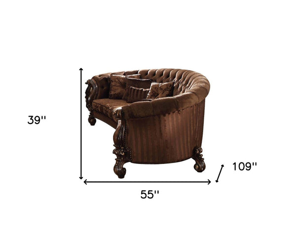 HomeRoots 55" Curved Velvet Sofa with Toss Pillows - Elegant Design, Comfortable Seating for Stylish Living Rooms Brown Velvet Cherry Oak 348227