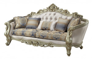 Homeroots 40" Antiqued White Velvet Curved Floral Sofa And Toss Pillows With Champagne Legs   348231