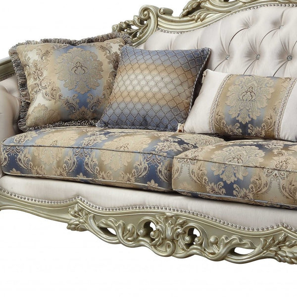 Homeroots 40" Antiqued White Velvet Curved Floral Sofa And Toss Pillows With Champagne Legs   348231