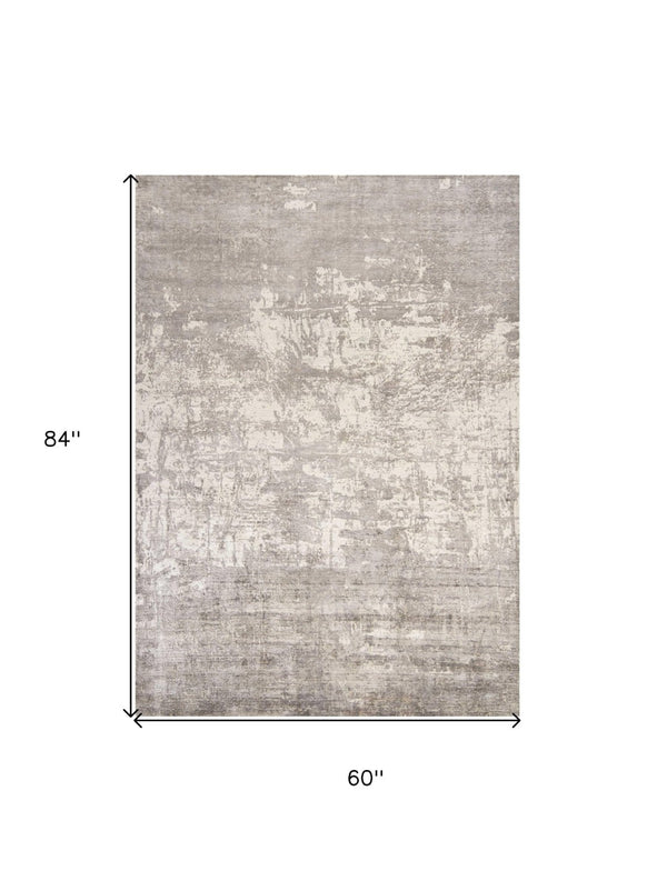 HomeRoots 5' Hand-Loomed Beige and Ivory Abstract Area Rug - Modern Elegance for Your Living Space 5' X 7' 350033