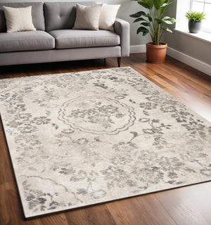 HomeRoots 8' Gray and Tan Floral Distressed Area Rug - Timeless Vintage Style for High-Traffic Family Spaces 8' X 10' 350055