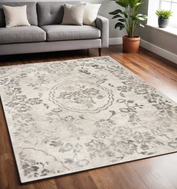 HomeRoots 8' Gray and Tan Floral Distressed Area Rug - Timeless Vintage Style for High-Traffic Family Spaces 8' X 10' 350055