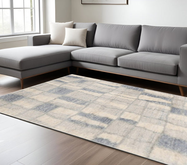HomeRoots 9' Ivory and Blue Abstract Geometric Area Rug – Modern Elegance for Large Spaces, Durable Comfort 9' X 13' 350105