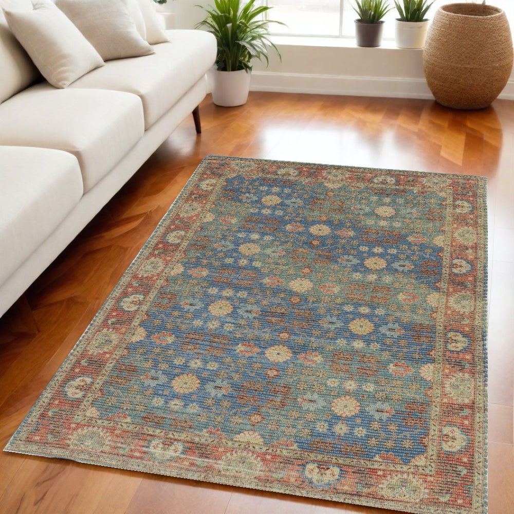 HomeRoots 5' Hand-Woven Floral Medallion Area Rug in Distressed Blue, Red, and Beige for Timeless Elegance 5' X 7' 352369
