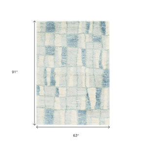 HomeRoots 5' Ivory and Blue Abstract Area Rug - Contemporary Artistry, Durable Performance for Any Space 5" x 8" 352490
