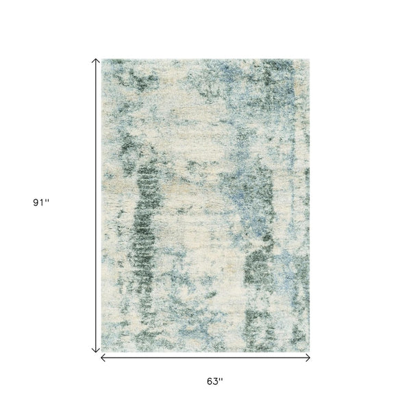 HomeRoots 5' Stylish Ivory and Blue Abstract Area Rug - Modern Elegance, Durable, Easy Care for Busy Homes 5" x 8" 352492