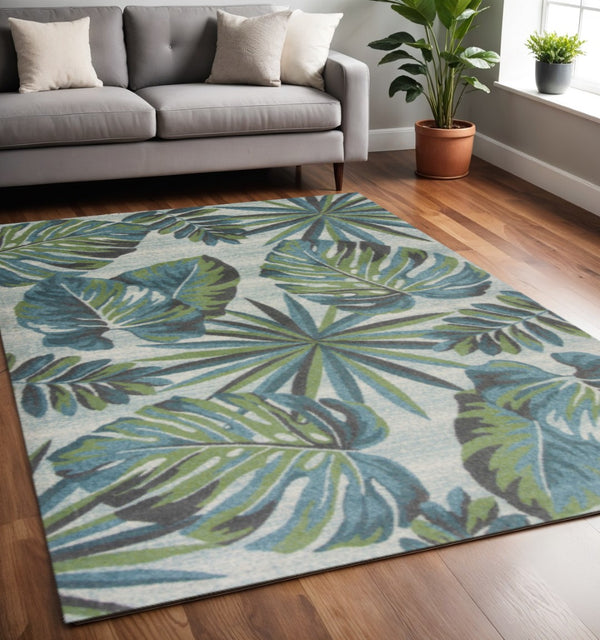 HomeRoots 7' Tropical Botanical Area Rug in Beige, Teal & Green - Stylish, Durable, Perfect for Modern Spaces 5' X 8' 352515