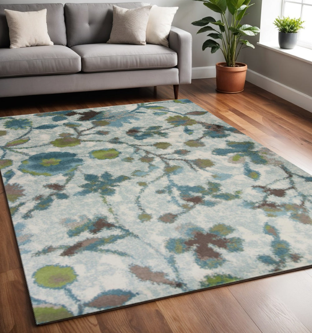 HomeRoots 8' Vibrant Teal Blue Floral Vines Area Rug - Durable, Stain-Resistant, Perfect for Homes with Kids & Pets 5' X 8' 352518