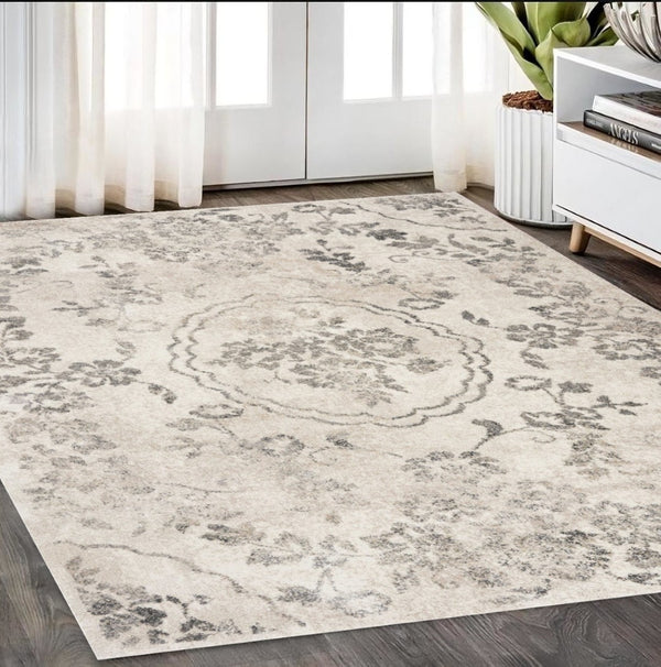 HomeRoots 8' Gray and Tan Floral Distressed Area Rug - Timeless Vintage Style for High-Traffic Family Spaces 5' X 8' 352929