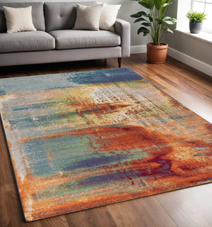 HomeRoots 8' Blue, Rust, and Orange Abstract Area Rug - Modern Design for Durable Living Room Style and Comfort 6' X 9' 353060
