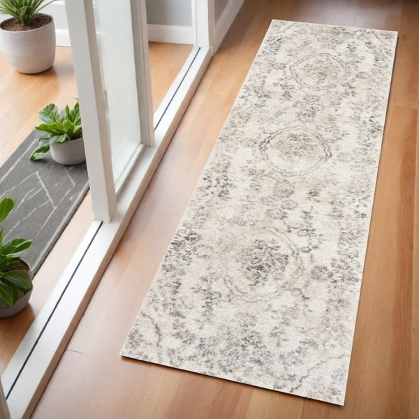 HomeRoots 8' Gray and Tan Floral Distressed Area Rug - Timeless Vintage Style for High-Traffic Family Spaces 7' Runner 353864