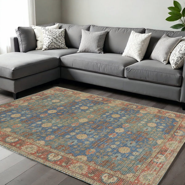 HomeRoots 5' Hand-Woven Floral Medallion Area Rug in Distressed Blue, Red, and Beige for Timeless Elegance 7' X 9' 354094