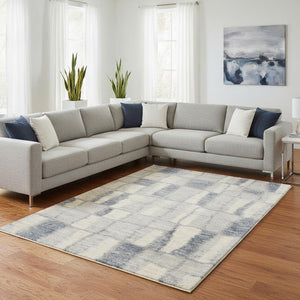 HomeRoots 9' Ivory and Blue Abstract Geometric Area Rug – Modern Elegance for Large Spaces, Durable Comfort 7' X 9' 354196