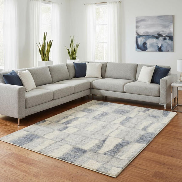 HomeRoots 9' Ivory and Blue Abstract Geometric Area Rug – Modern Elegance for Large Spaces, Durable Comfort 7' X 9' 354196
