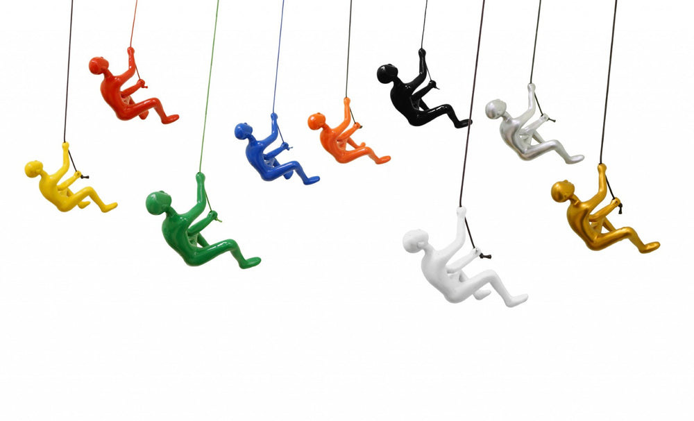 HomeRoots Set of Nine Colorful Resin Climbing Man Sculptures - Whimsical 3D Wall Art for Any Room Decor 358143