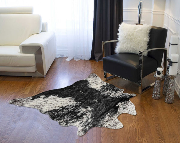 HomeRoots 4' X 5' Black and White Faux Fur Cowhide Area Rug - Soft, Washable, Modern Animal Print Accent Piece 358151