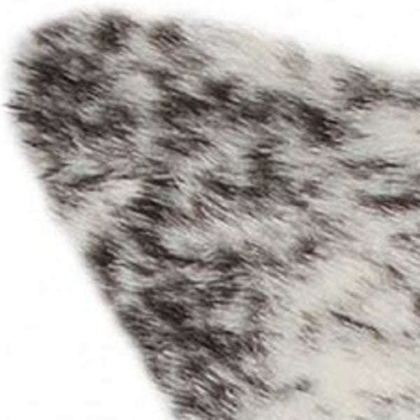 HomeRoots 4' X 5' Black and White Faux Fur Cowhide Area Rug - Soft, Washable, Modern Animal Print Accent Piece 358151