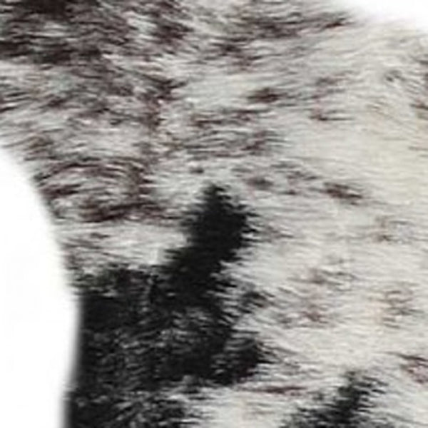 HomeRoots 5' X 8' Black And White Faux Fur Cowhide Area Rug - Luxurious, Washable, Modern Design for Any Space 358152