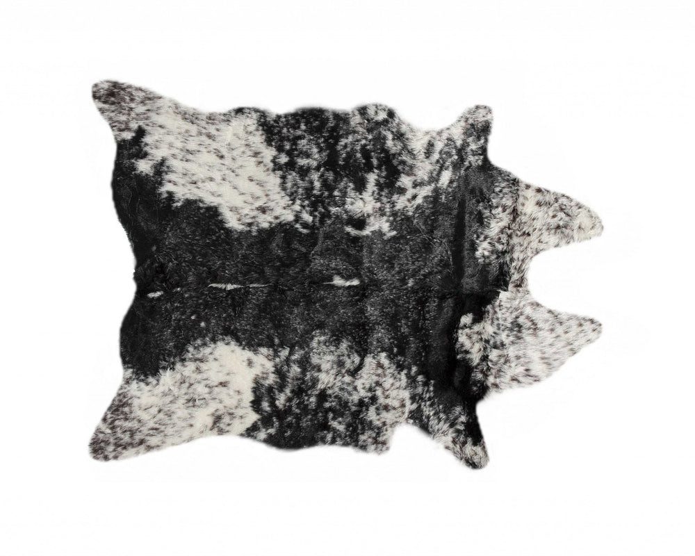 HomeRoots 5' X 8' Black And White Faux Fur Cowhide Area Rug - Luxurious, Washable, Modern Design for Any Space 358152