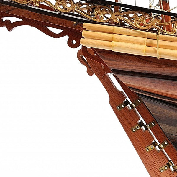 Homeroots 27" Brown Manufactured Wood Boat Hand Painted Sculpture  Solid Wood 364268