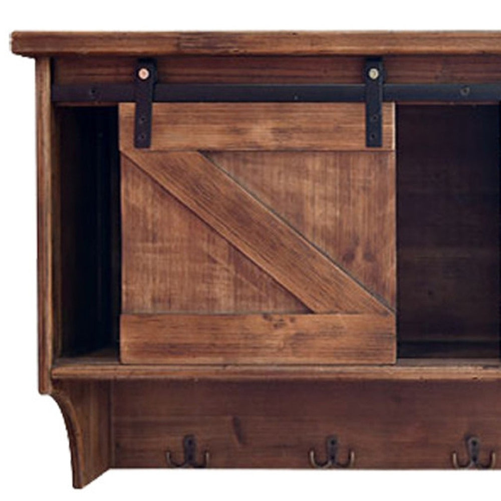 HomeRoots 40" Rustic Brown Wood Wall Shelf with Sliding Barn Door & 5 Hooks for Stylish Storage Solutions 370380
