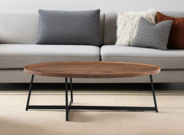 HomeRoots 24" Elegant Brown and Black Oval Coffee Table with Sturdy Metal Base for Modern Living Spaces 370464