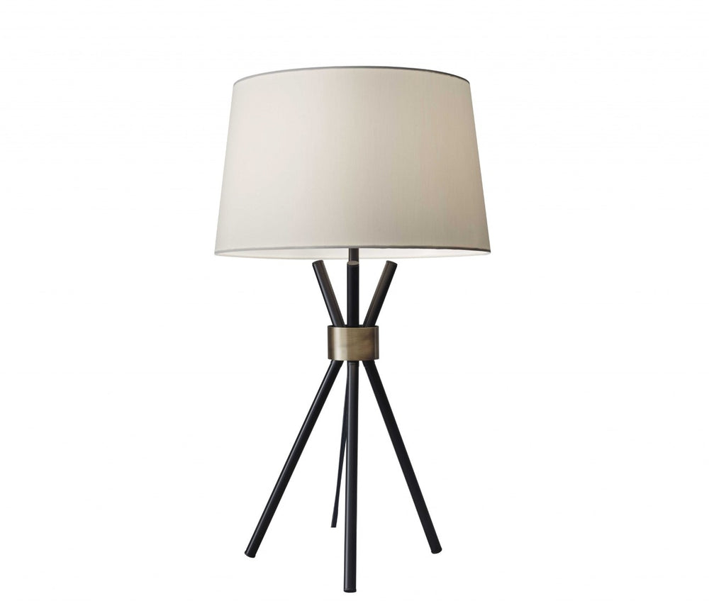HomeRoots Black Metal Tripod Table Lamp with Antique Brass Accent – Mid-Century Charm & Modern Functionality 372639
