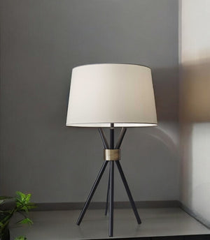 HomeRoots Black Metal Tripod Table Lamp with Antique Brass Accent – Mid-Century Charm & Modern Functionality 372639