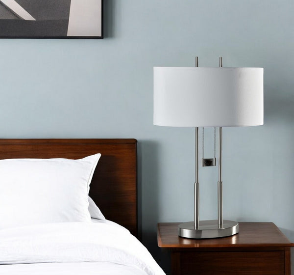 HomeRoots 27" Silver Metal Two-Light Bedside Lamp with Off-White Shade for Modern Elegance and Functionality 372649