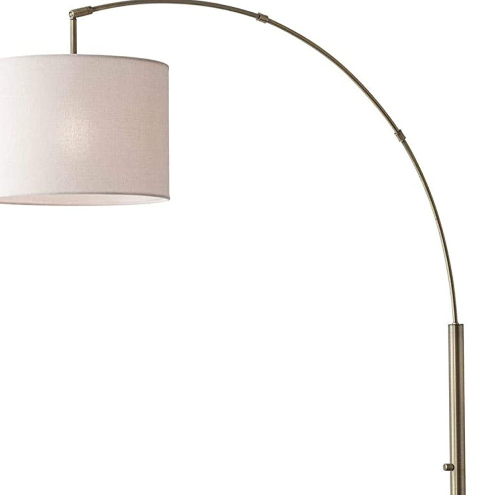 Homeroots 74" Brass Arc Floor Lamp With Off White Solid Color Drum Shade Brass Metal 372710