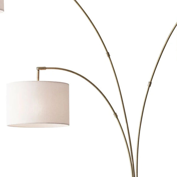 Homeroots 74" Brass Three Light Arc Floor Lamp With Off White Fabric Drum Shade Brass Metal 372712