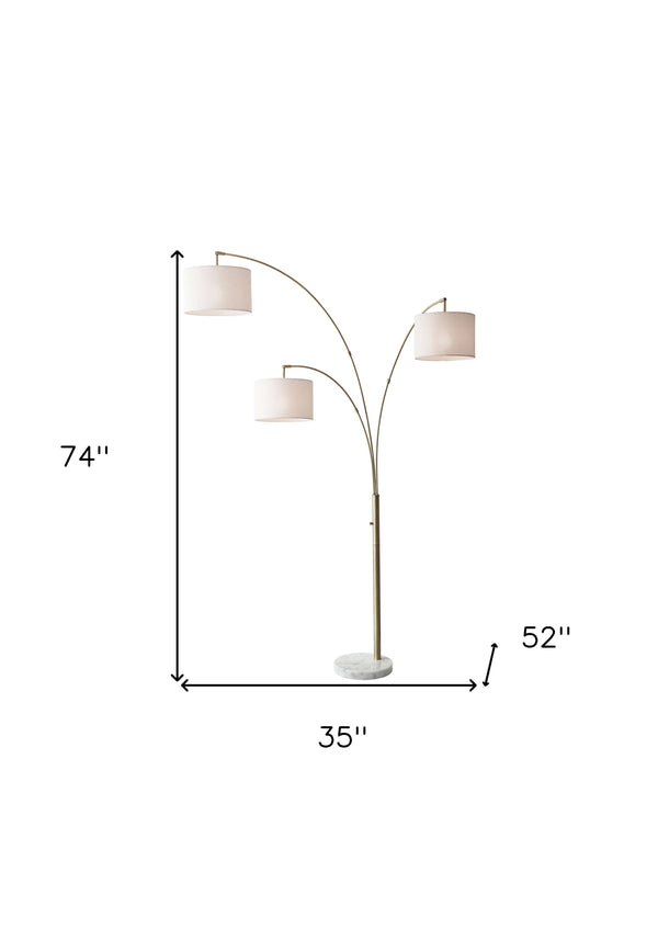 Homeroots 74" Brass Three Light Arc Floor Lamp With Off White Fabric Drum Shade Brass Metal 372712
