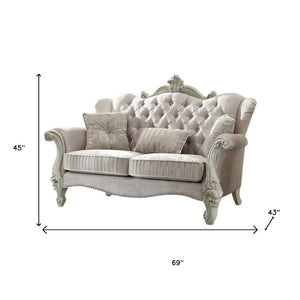 HomeRoots 69" Chesterfield Loveseat with Elegant Button-Tufting and Plush Toss Pillows for Timeless Style Ivory 374220