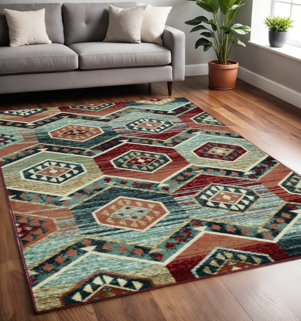 HomeRoots 7' Vibrant Red and Blue Geometric Round Area Rug - Durable, Stylish Design for High-Traffic Spaces 5' X 8' 374402