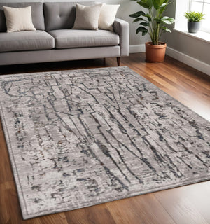 HomeRoots 5' Gray and Black Abstract Distressed Area Rug - Modern Comfort, Durable Design for Any Space 5' X 8' 374801