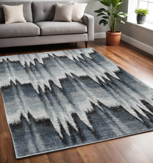 HomeRoots 5' Contemporary Abstract Area Rug in Ivory, Blue, and Gray - Durable, Stylish, and Low-Maintenance Design 5' X 8' 374852